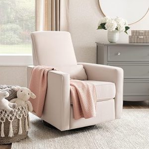 A baby's room with a white chair and a pink blanket, ideal for breastfeeding.